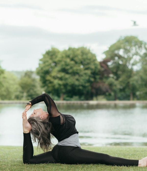 Young girl stands confidently in a tree yoga pose showing balance.